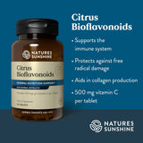 Nature's Sunshine Citrus Bioflavonoids supplement bottle on a dark blue background with white text listing benefits such as immune support, antioxidant protection, collagen aid, and 500 mg vitamin C per tablet.