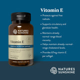Natures Sunshine Vitamin E softgel bottle on a dark blue background with text describing benefits of Vitamin E.