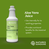 Bottle of Natures Sunshine Aloe Vera Juice on a green background with product details.