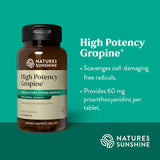 Natures Sunshine High Potency Grapeine supplement bottle on a green background