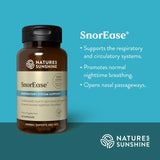 Natures Sunshine SnorEase Respiratory System Support dietary supplement bottle on a teal background with product benefits text on the right.