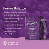 Natures Sunshine Power Balance dietary supplement packaging, featuring a purple box and a single sachet with a purple background and text detailing product benefits.