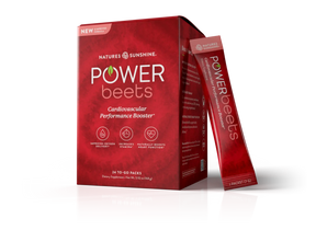 Nature's Sunshine Power Beets dietary supplement box in red packaging with two individual stick packs standing beside it on a white background.