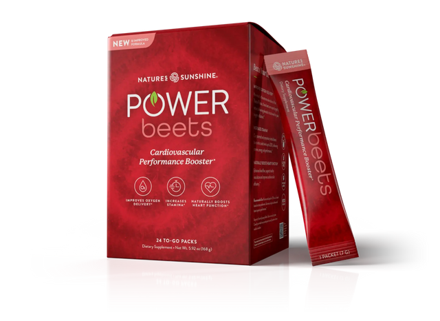 Nature's Sunshine Power Beets dietary supplement box in red packaging with two individual stick packs standing beside it on a white background.