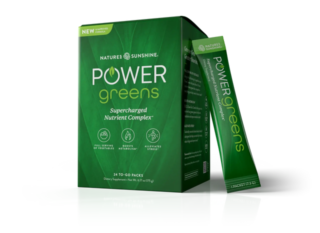 Nature's Sunshine Power Greens dietary supplement box in green, with one single-serve packet standing beside it on a clean white background.