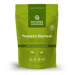 Nature's Sunshine Nature's Harvest Super-Food Instant Beverage in a lime green resealable pouch, displayed on a clean white background.