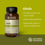 Natures Sunshine Alfalfa supplement bottle on a green background with product details.