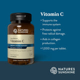 Natures Sunshine Vitamin C supplement bottle with product details on a blue background