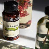 Nature's Sunshine Goldenseal supplement bottle on a surface with a blurred background