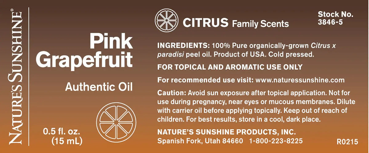 A brown rectangular product label for Nature's Sunshine Citrus Family Scents Pink Grapefruit Authentic Oil, showing text details, ingredients, stock number, and usage information.