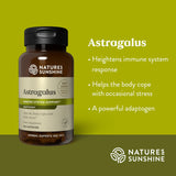 A bottle of Nature's Sunshine Astragalus immune system support dietary supplement on a green background with text describing its benefits.