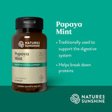 Natures Sunshine Papaya Mint supplement bottle on a green background