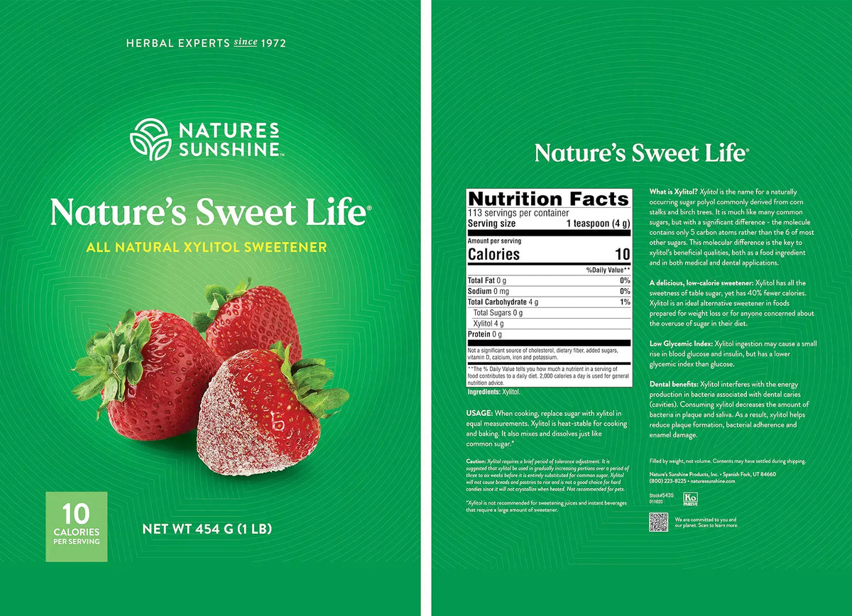 Front and back packaging of Nature's Sweet Life all natural xylitol sweetener by Nature's Sunshine, featuring a green design with images of fresh strawberries and a nutrition facts panel.