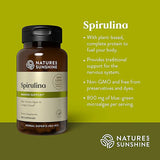 Nature's Sunshine Spirulina dietary supplement bottle on a green background with product text and benefits listed on the right.