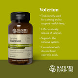 Natures Sunshine Valerian supplement bottle on a green background with product details.