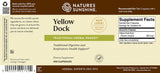 Front label of Nature's Sunshine Yellow Dock herbal remedy supplement, showing product name, supplement facts, barcode, and company contact information on a beige label with brown and green accents.