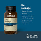 Natures Sunshine Zinc Lozenge herbal supplement bottle on a dark blue background with product details and benefits listed on the right.
