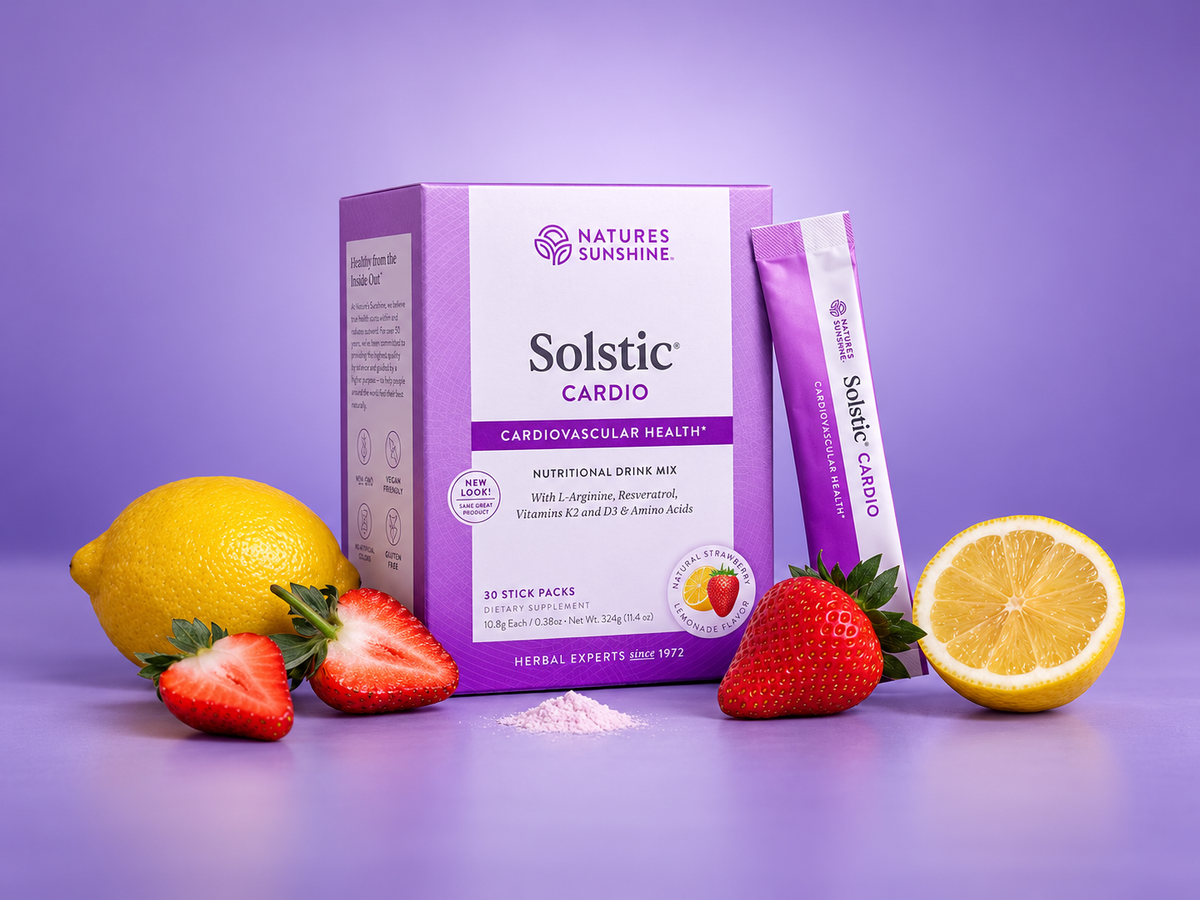 Nature's Sunshine Solstic Cardio herbal drink mix box and single stick pack displayed on a lavender background, styled with fresh strawberries and lemon slices.