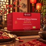 A red box of Natures Sunshine Traditional Chinese Medicine Positive Pack is displayed on a wooden tray in a warm, traditional setting with red lanterns, a teapot, and dried herbs.
