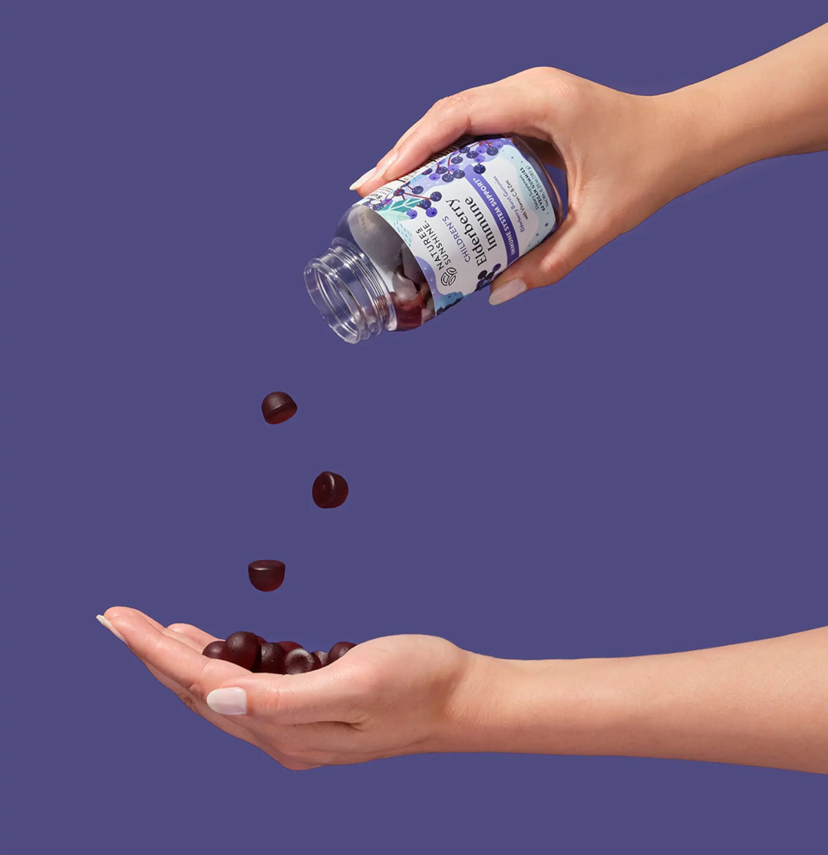 Elderberry Immune falling into hand