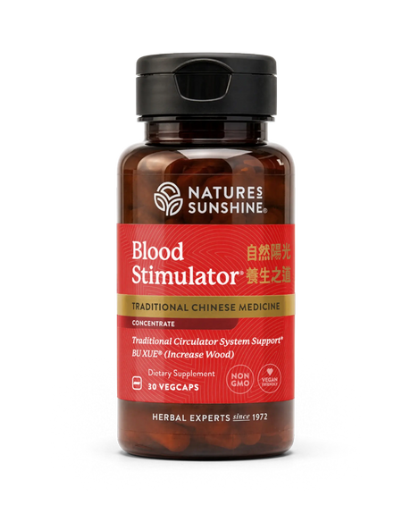 A bottle of Nature's Sunshine Blood Stimulator dietary supplement, featuring a dark amber brown bottle, a black cap, and a red label with gold and white text.