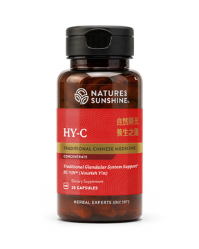 A bottle of Natures Sunshine HY-C Traditional Chinese Medicine dietary supplement, featuring a red label and black cap, containing 30 capsules.