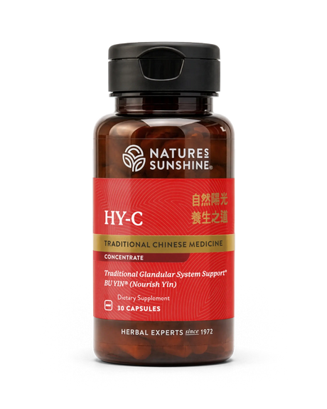 A bottle of Natures Sunshine HY-C Traditional Chinese Medicine dietary supplement, featuring a red label and black cap, containing 30 capsules.
