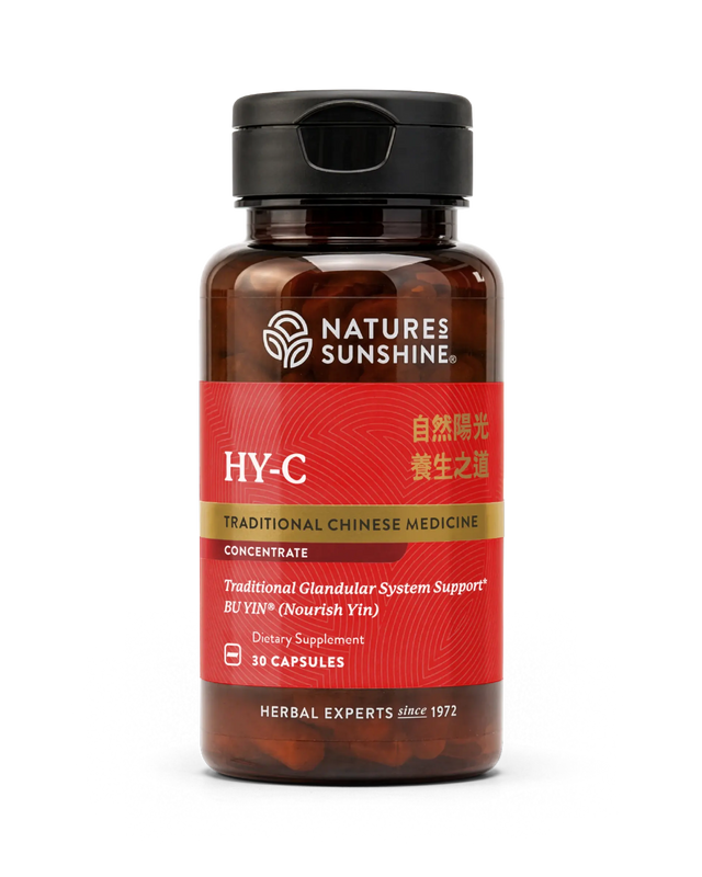 A bottle of Natures Sunshine HY-C Traditional Chinese Medicine dietary supplement, featuring a red label and black cap, containing 30 capsules.