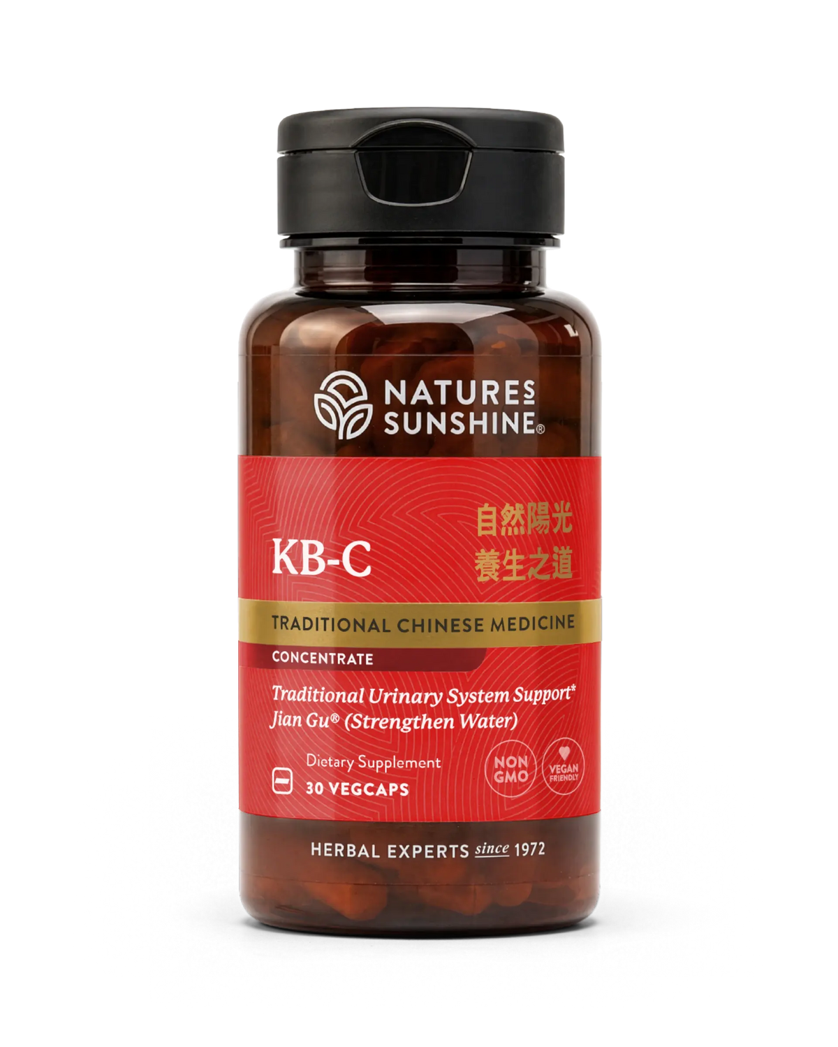 A bottle of Nature's Sunshine KB-C Traditional Chinese Medicine dietary supplement, featuring a dark amber bottle, black cap, and a red label with gold and white text.