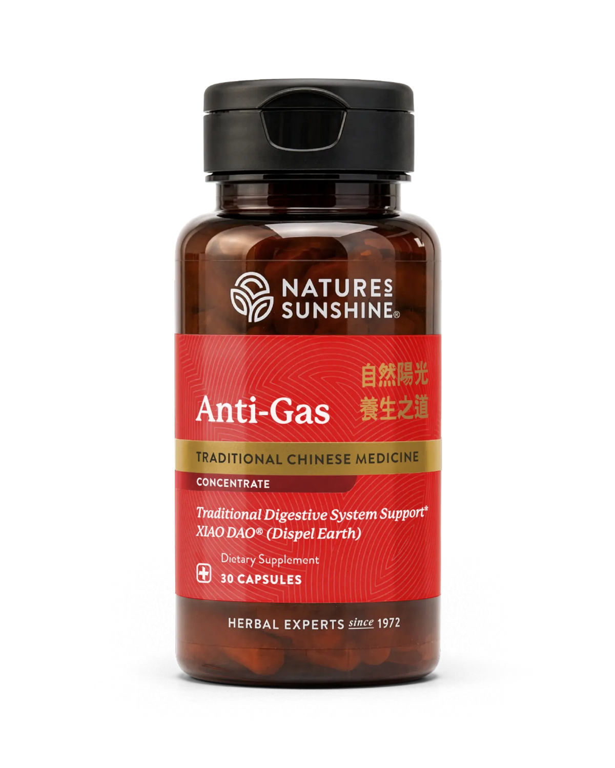 A bottle of Natures Sunshine Anti-Gas dietary supplement, featuring a dark amber brown bottle, a black cap, and a red label with gold and white text, set against a plain white background.