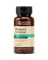 A bottle of Nature's Sunshine Women's X-Action herbal dietary supplement, featuring an amber glass bottle with a black cap and a beige label with green and white text.