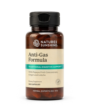 A bottle of Nature's Sunshine Anti-Gas Formula dietary supplement, featuring an amber brown bottle, black cap, and a beige label with green and white text, set against a plain white background.