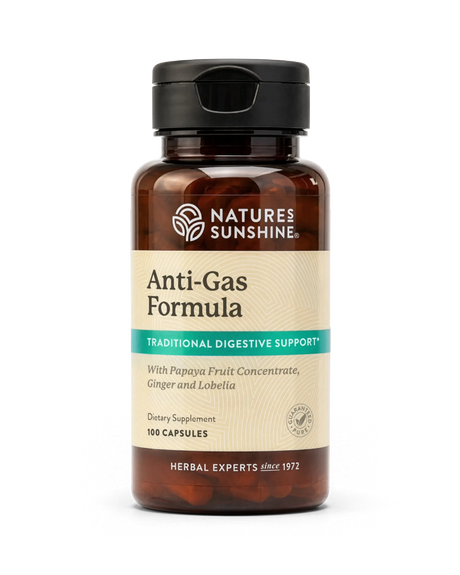 A bottle of Nature's Sunshine Anti-Gas Formula dietary supplement, featuring an amber brown bottle, black cap, and a beige label with green and white text, set against a plain white background.