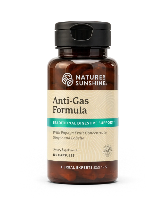 A bottle of Nature's Sunshine Anti-Gas Formula dietary supplement, featuring an amber brown bottle, black cap, and a beige label with green and white text, set against a plain white background.