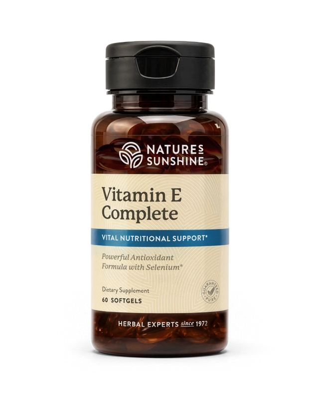 Nature's Sunshine Vitamin E Complete dietary supplement bottle with a black cap and amber brown glass, on a white background.