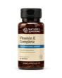 Nature's Sunshine Vitamin E Complete dietary supplement bottle with a black cap and amber brown glass, on a white background.