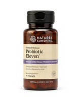A bottle of Nature's Sunshine Probiotic Eleven dietary supplement, featuring an amber brown bottle, a black cap, and a beige label with purple accents, set against a plain white background.