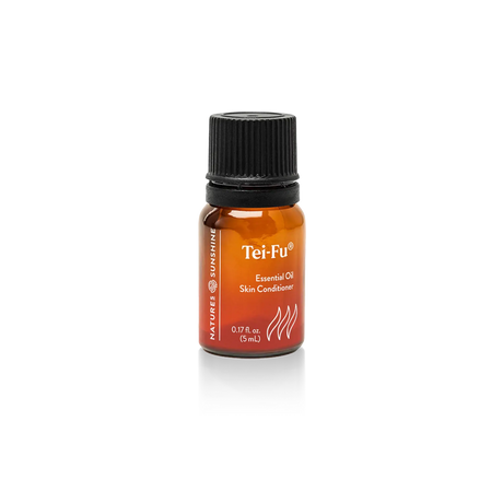 A small amber glass bottle of Tei-Fu Skin Conditioner essential oil with a black cap, centered on a white background.