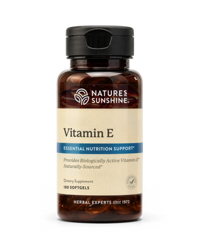 A bottle of Nature's Sunshine Vitamin E dietary supplement, 180 softgels, in an amber brown bottle with a black cap and a beige label.