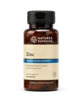 Nature's Sunshine Zinc dietary supplement bottle with amber plastic and a beige label, shown on a plain white background.