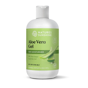A bottle of Nature's Sunshine Aloe Vera Gel skin moisturizer, featuring a white bottle with a light green label and a white flip-top cap, set against a plain white background.