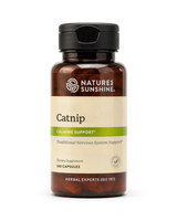 A bottle of Natures Sunshine Catnip dietary supplement with a black cap and amber-brown bottle, featuring a beige and green label, on a white background.