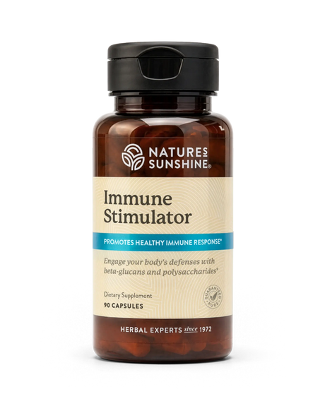 A bottle of Nature's Sunshine Immune Stimulator dietary supplement, featuring an amber brown bottle, beige label, and black cap, set against a plain white background.