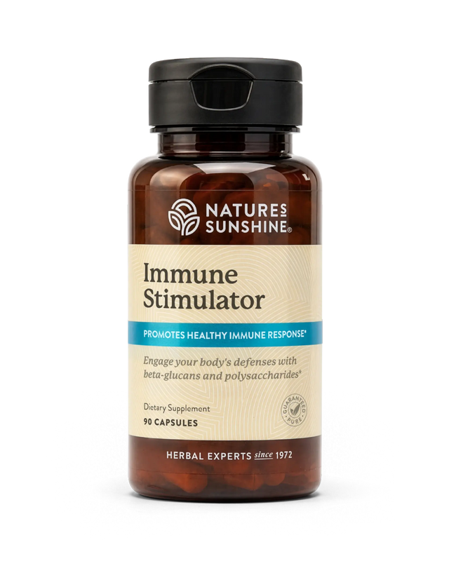 A bottle of Nature's Sunshine Immune Stimulator dietary supplement, featuring an amber brown bottle, beige label, and black cap, set against a plain white background.