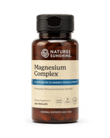 Nature's Sunshine Magnesium Complex dietary supplement bottle with a black cap and amber-brown plastic, containing 100 vegcaps, on a white background.