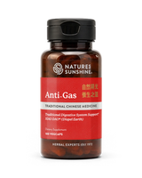 A bottle of Nature's Sunshine Anti-Gas dietary supplement, featuring a dark amber glass bottle, a black cap, and a red label with white and gold text.