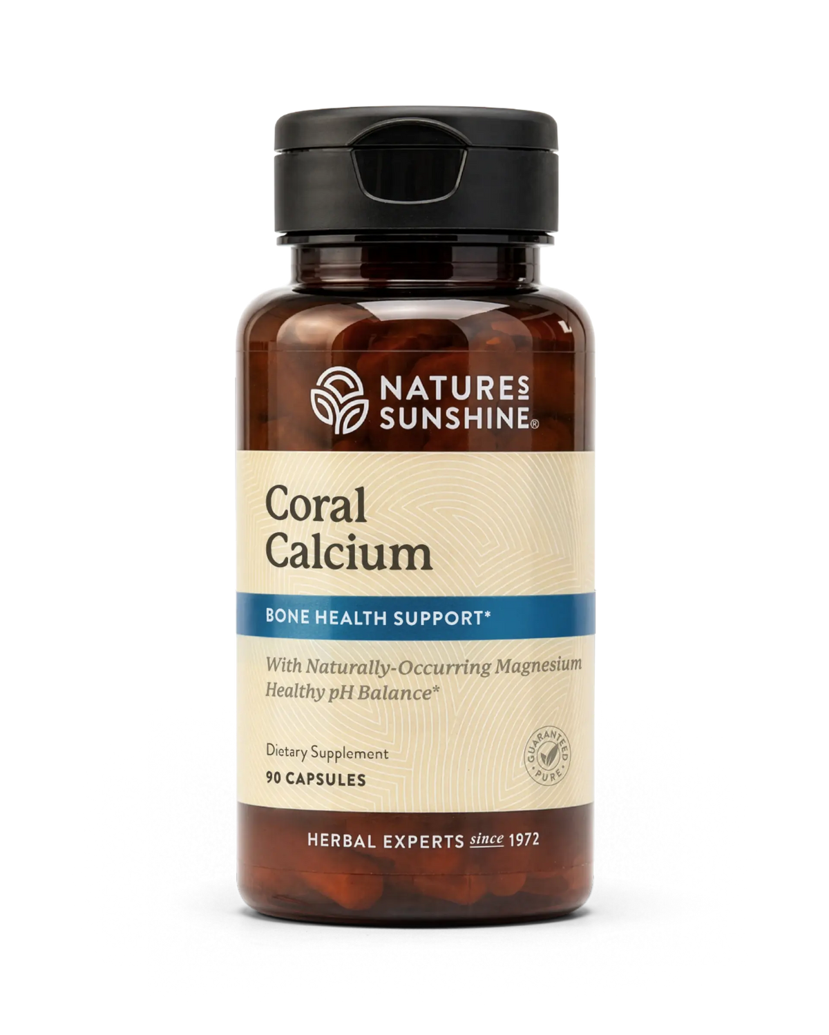 A bottle of Nature's Sunshine Coral Calcium dietary supplement, featuring an amber brown bottle, a black cap, and a beige label with blue accents.
