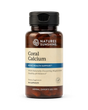 A bottle of Nature's Sunshine Coral Calcium dietary supplement, featuring an amber brown bottle, a black cap, and a beige label with blue accents.