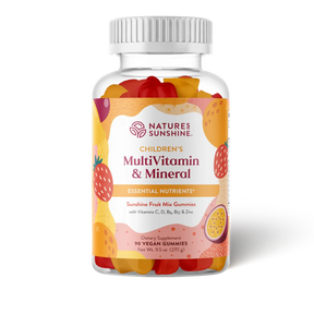 A bottle of Nature's Sunshine Children's MultiVitamin & Mineral gummies, featuring a white ribbed cap and a colorful label with illustrations of strawberries, oranges, and a passion fruit. The clear bottle reveals the multicolored gummy candies inside, set against a plain white background.