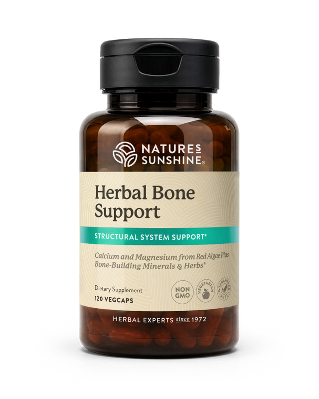 A bottle of Nature's Sunshine Herbal Bone Support dietary supplement, featuring an amber glass bottle, black cap, and beige label with a teal accent stripe.